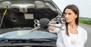 woman-with-wrench-stand-near-car-with-open-hood-road-repair-auto-ar-journey
