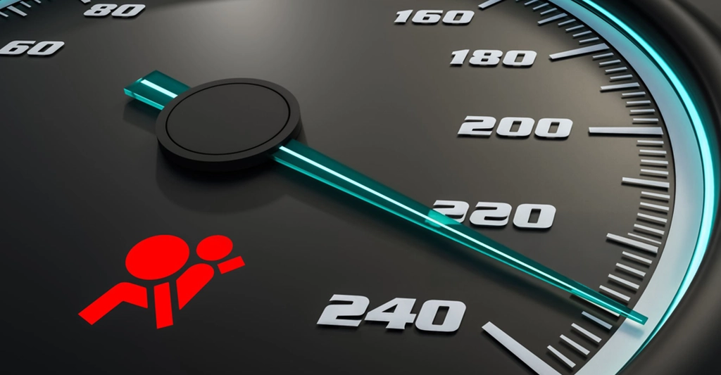 A close-up shot of a car speedometer, rendered in a sleek, modern digital art style. The speedometer features a black background with white numerals indicating speed, ranging from 60 to 240. In the lower-left corner, a red airbag warning symbol is visible,
