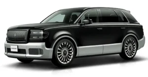 A black Toyota Century SUV with a silver trim along the bottom. The car has a large, rectangular grille with a mesh pattern and the word "CENTURY" on the lower left side.