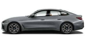 A side view of a gray BMW 4 Series Gran Coupe, showcasing its sleek design and sporty features.