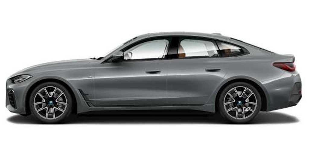 A side view of a gray BMW 4 Series Gran Coupe, showcasing its sleek design and sporty features.