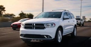 A 2019 Dodge Durango driving on the highway, showcasing its sleek design and powerful presence.