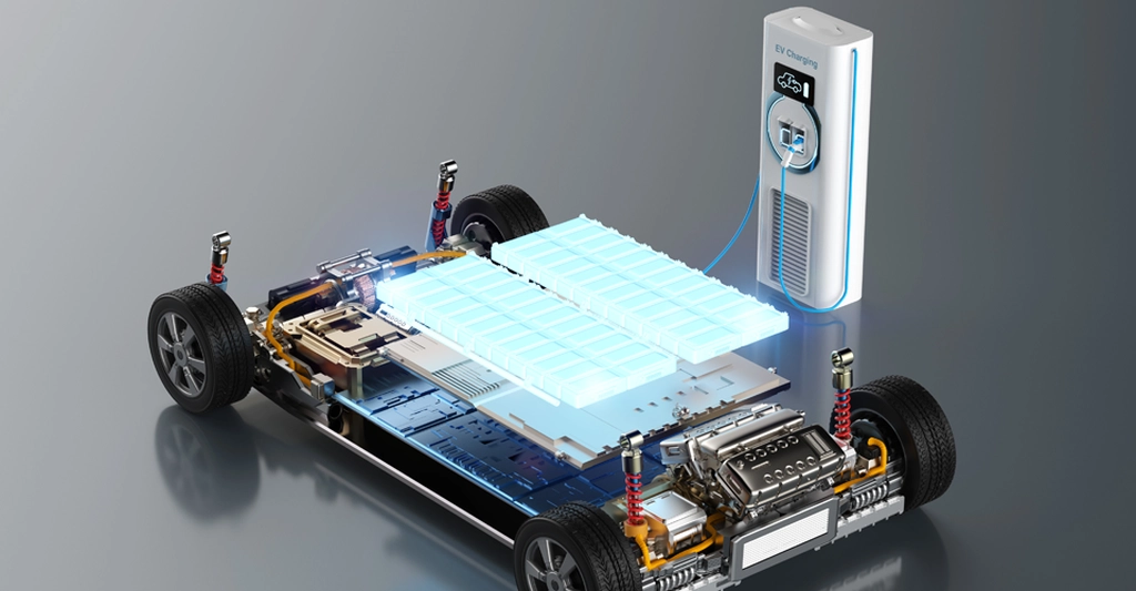 A digital rendering of an electric vehicle chassis with a charging station. The chassis is detailed, showcasing the suspension, wheels, and the electric motor components.