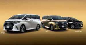 Three Toyota Alphard minivans are displayed against a gradient gold background. The minivan on the left is white, the one in the middle is gold, and the one on the right is black. Each car has a large, intricate front grille with the Toyota logo prominently displayed.