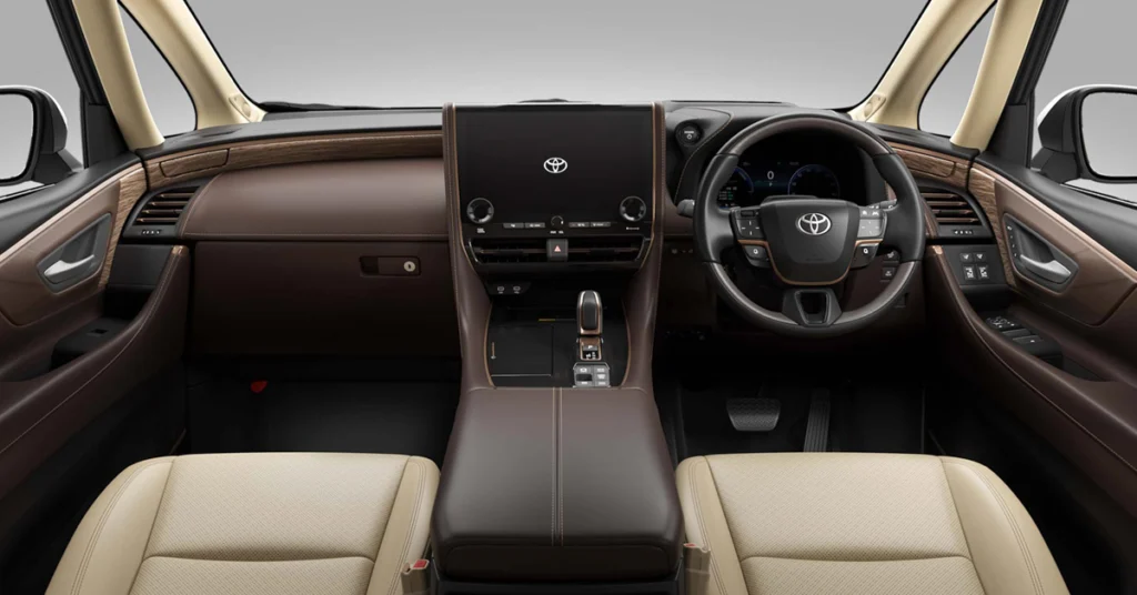 A symmetrical, eye-level, medium shot captures the interior of a Toyota Alphard  car, focusing on the dashboard and front seats. 