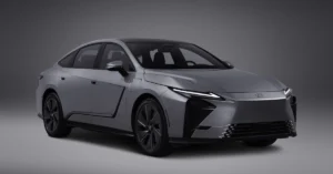 A digital photograph of a gray Lexus 2026 Lexus ES concept car against a gray background. The car is a four-door sedan with a sleek, aerodynamic design.