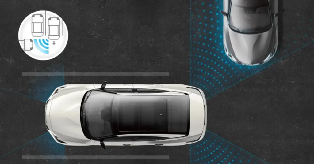Overhead shot of a white car with a black sunroof, parked between parking lines, with another car parked in front of it, the image has blue dots that indicate the parking sensors.