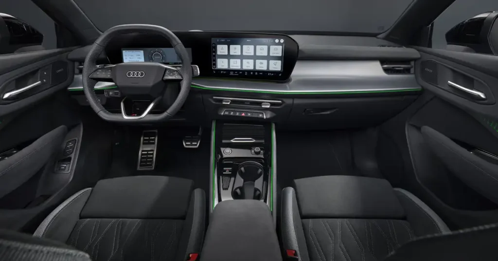 A detailed shot of the interior of an 2025 New Audi Q3 car, focusing on the dashboard and front seats. The interior is predominantly black with silver accents and thin green LED strips highlighting the design. The dashboard features a large infotainment screen in the center, displaying various icons.