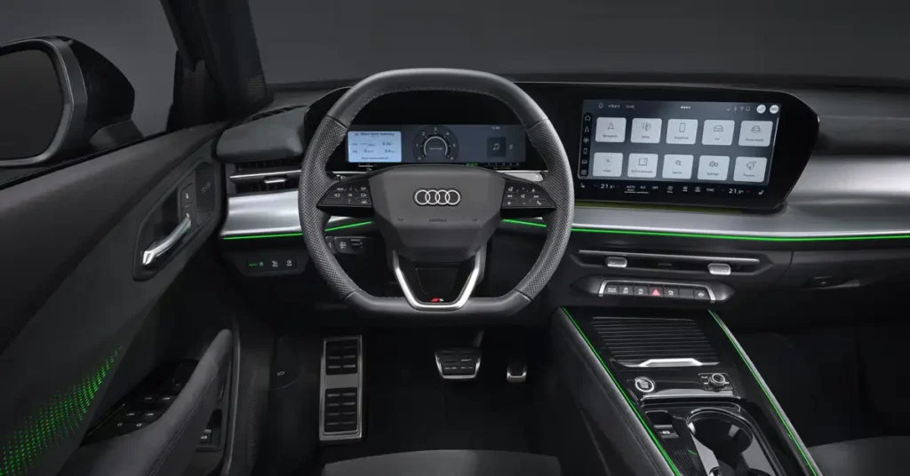 A detailed shot of the interior of an 2025 New Audi Q3 car, focusing on the dashboard and front seats. The interior is predominantly black with silver accents and thin green LED strips highlighting the design. The dashboard features a large infotainment screen in the center, displaying various icons.