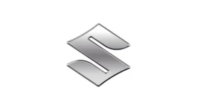 A digital rendering of the Suzuki logo, presented in a metallic silver finish against a stark white background.