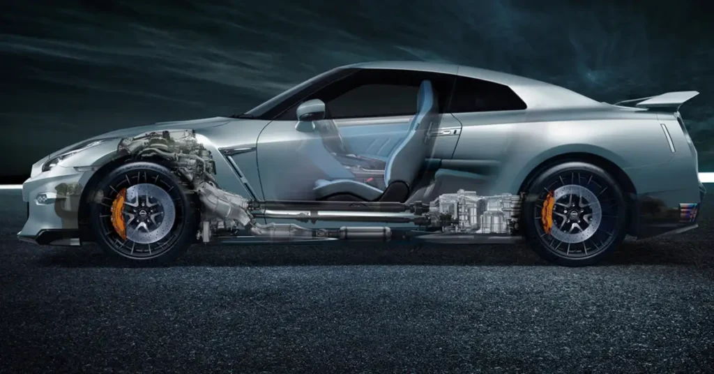 A cutaway view of a silver Nissan GT-R, showcasing its internal components. The car is positioned on a dark asphalt surface, with a gradient background transitioning from light to dark.