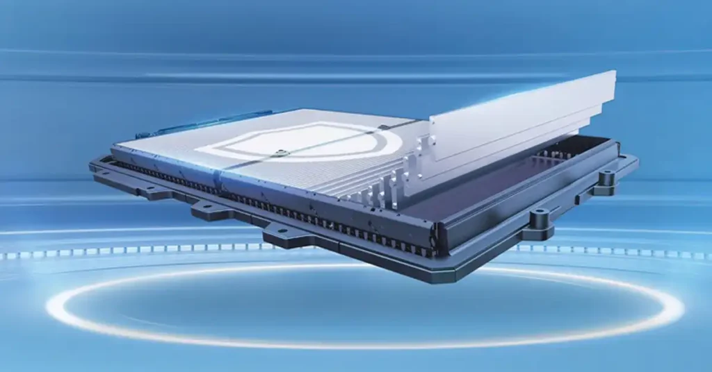 A 3D render shows a disassembled Blade Battery battery pack, with the top layer lifted to reveal internal components. The battery pack is dark gray with a metallic sheen and sits on a black base with visible mounting points