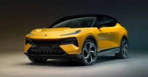 A side profile of a yellow Lotus Eletre electric SUV is showcased against a dark, gradient background. The car is positioned on a light gray floor, with subtle lighting that highlights its sleek lines and aerodynamic design.