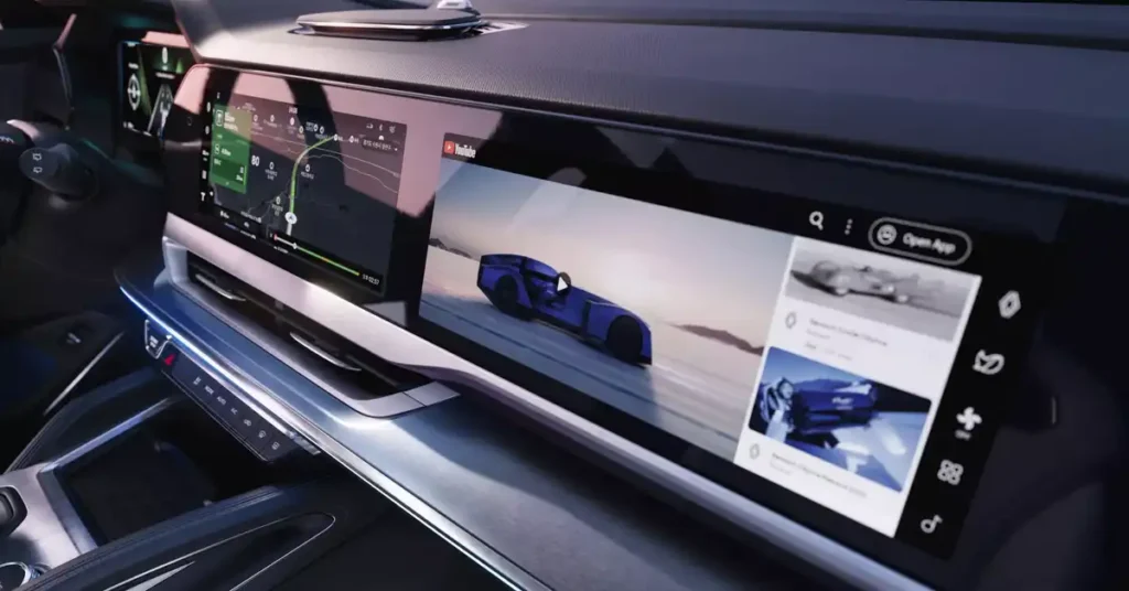 A wide, horizontal A RENAULT FILANTE ESPRIT ALPINE SUV infotainment screen displays multiple applications. On the left, a navigation map with a route is shown. The center of the screen features a YouTube video of a futuristic blue car driving on a snowy landscape. To the right, a sidebar shows a list of suggested videos, also featuring cars.