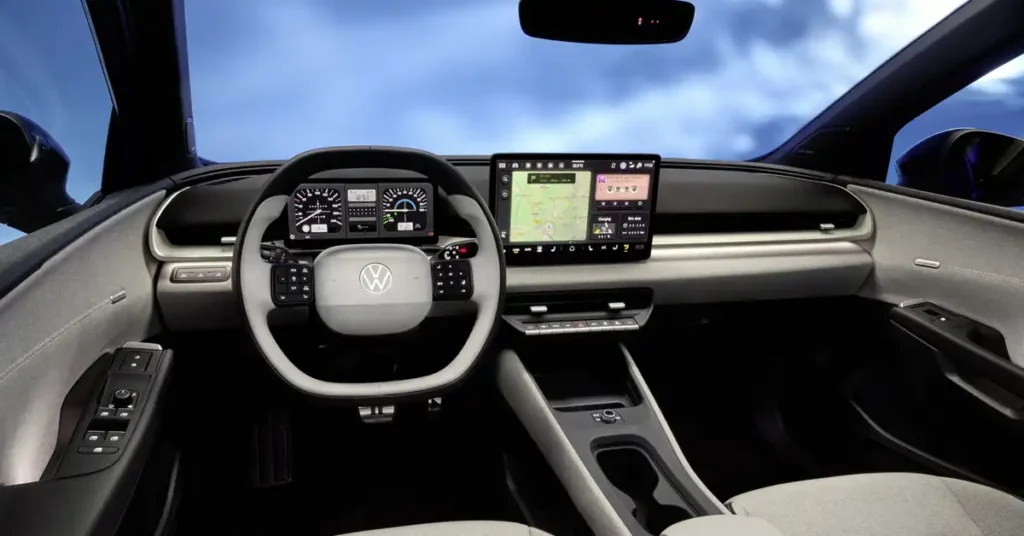 A wide-angle shot shows the interior A 2026 Volkswagen ID. Polo electric car, looking forward from the passenger seat. The dashboard is dominated by a large, central touchscreen displaying a navigation map and various icons.